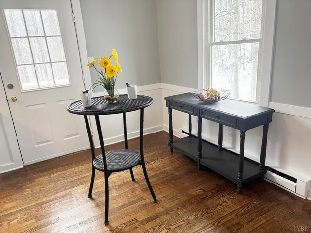 a view of a workspace with furniture and window in a room