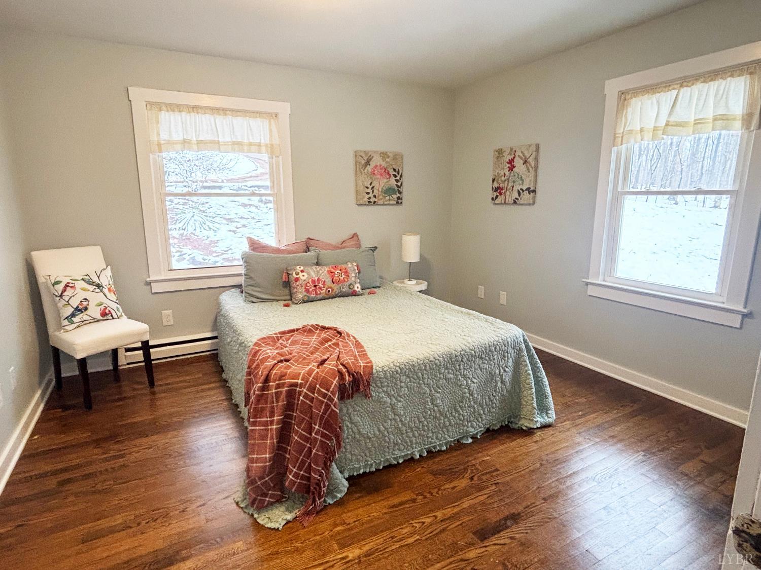 447 Matohe Road Monroe, VA 24574 - Photo 9 of 20 a bedroom with a bed and wooden floor