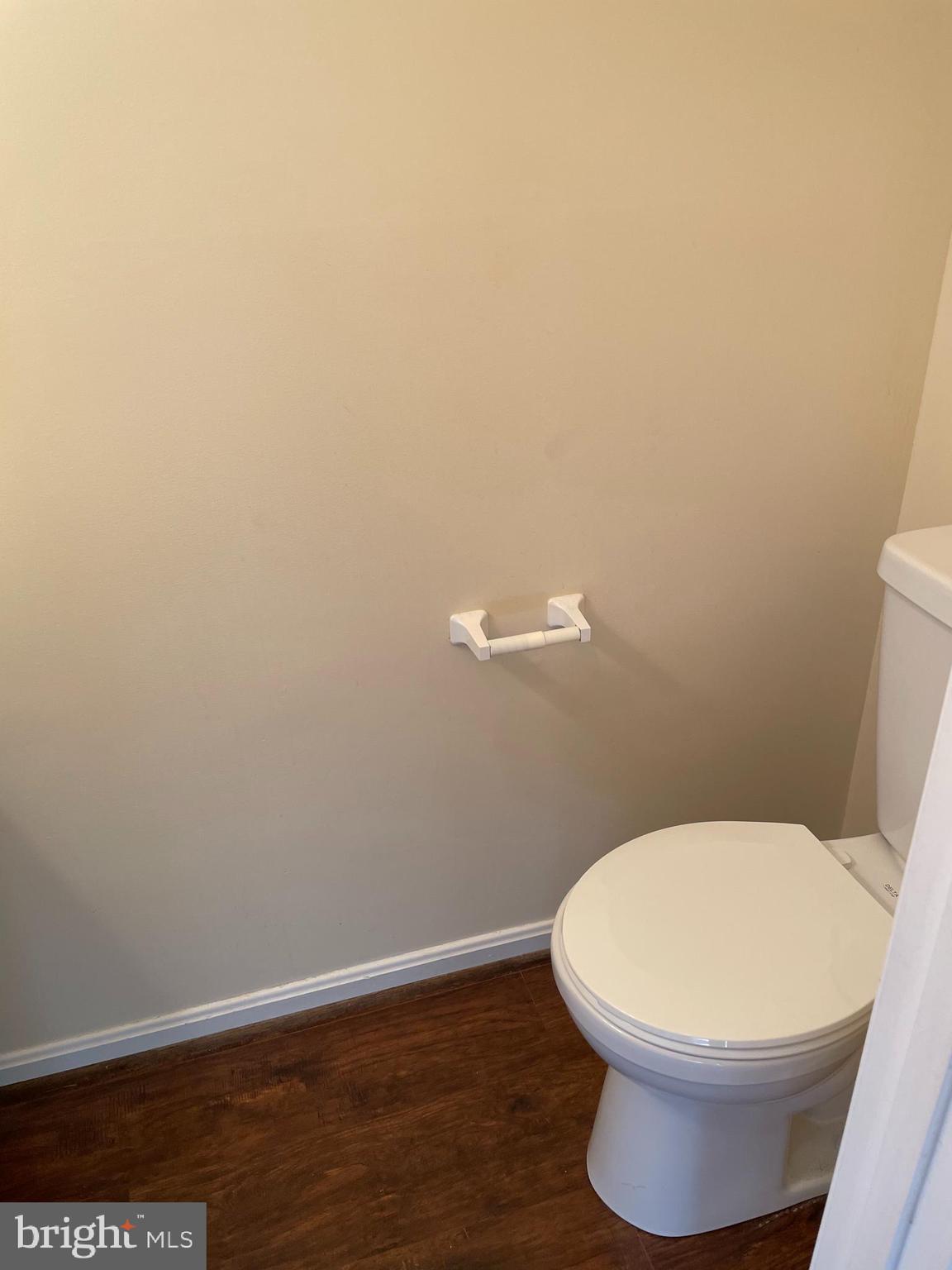 12405 Gooderham Way Gaithersburg, MD 20878 - Photo 26 of 31 a white toilet sitting next to a white wall