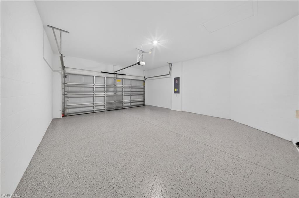 2224 Dragonfruit Way Naples, FL 34120 - Photo 21 of 33 Garage featuring electric panel