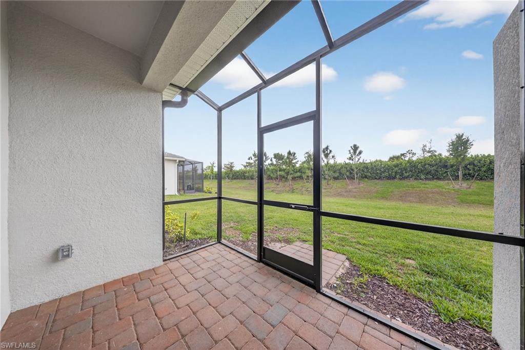 2224 Dragonfruit Way Naples, FL 34120 - Photo 23 of 33 View of unfurnished sunroom