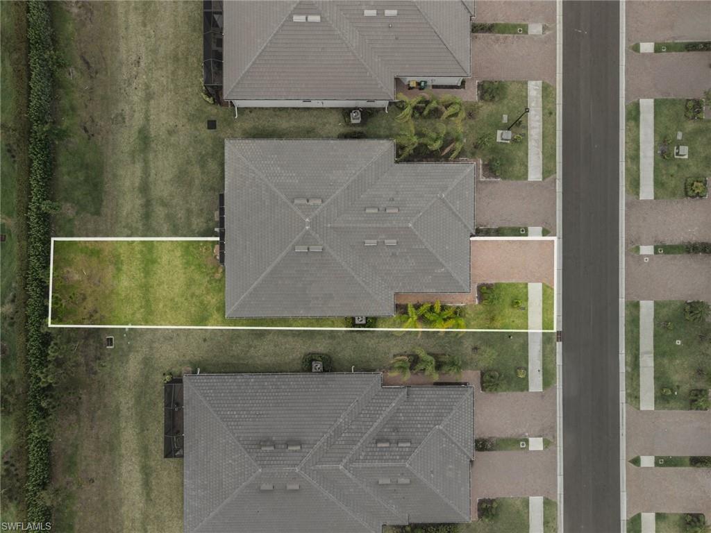 2224 Dragonfruit Way Naples, FL 34120 - Photo 25 of 33 Aerial view of property and surrounding area featuring property parcel outlined