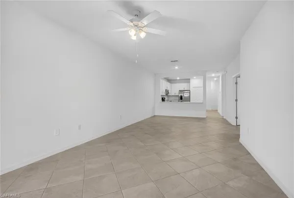 a view of a livingroom with a kitchen