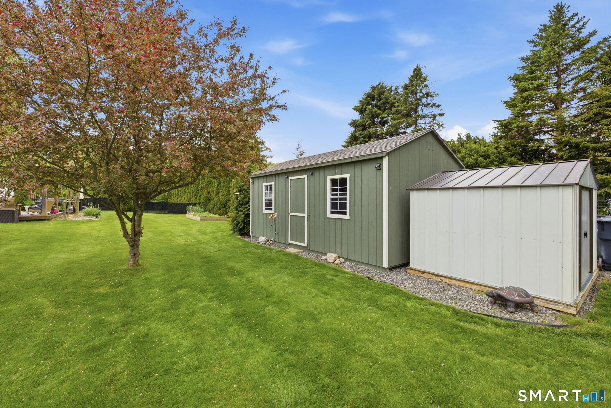 7 Stardust Drive Enfield, CT 06082 - Photo 34 of 38 a house view with a garden space