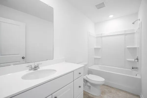 a bathroom with a sink a toilet and a bathtub