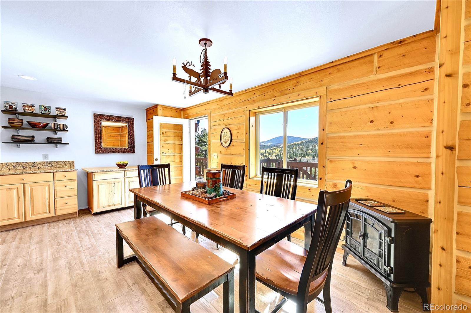 278 Clark Road Bailey, CO 80421 - Photo 17 of 44 a view of a dining room with furniture window and wooden floor