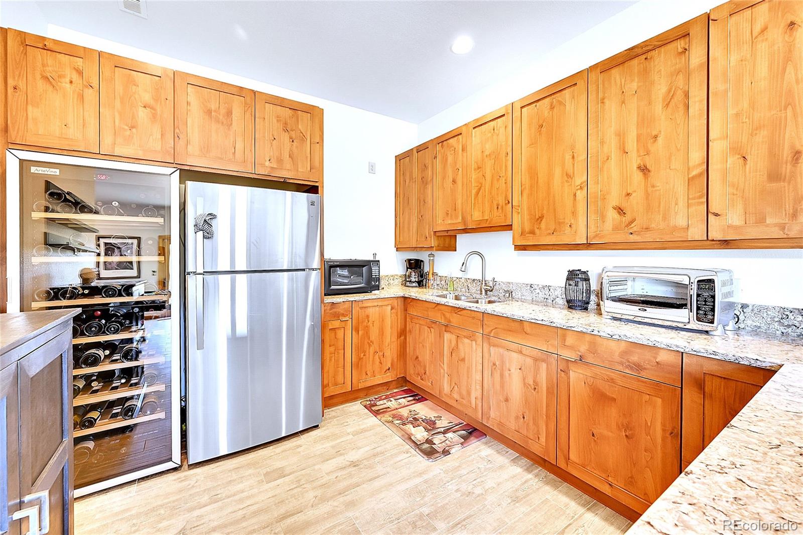 278 Clark Road Bailey, CO 80421 - Photo 26 of 44 a kitchen with stainless steel appliances granite countertop a refrigerator and a sink