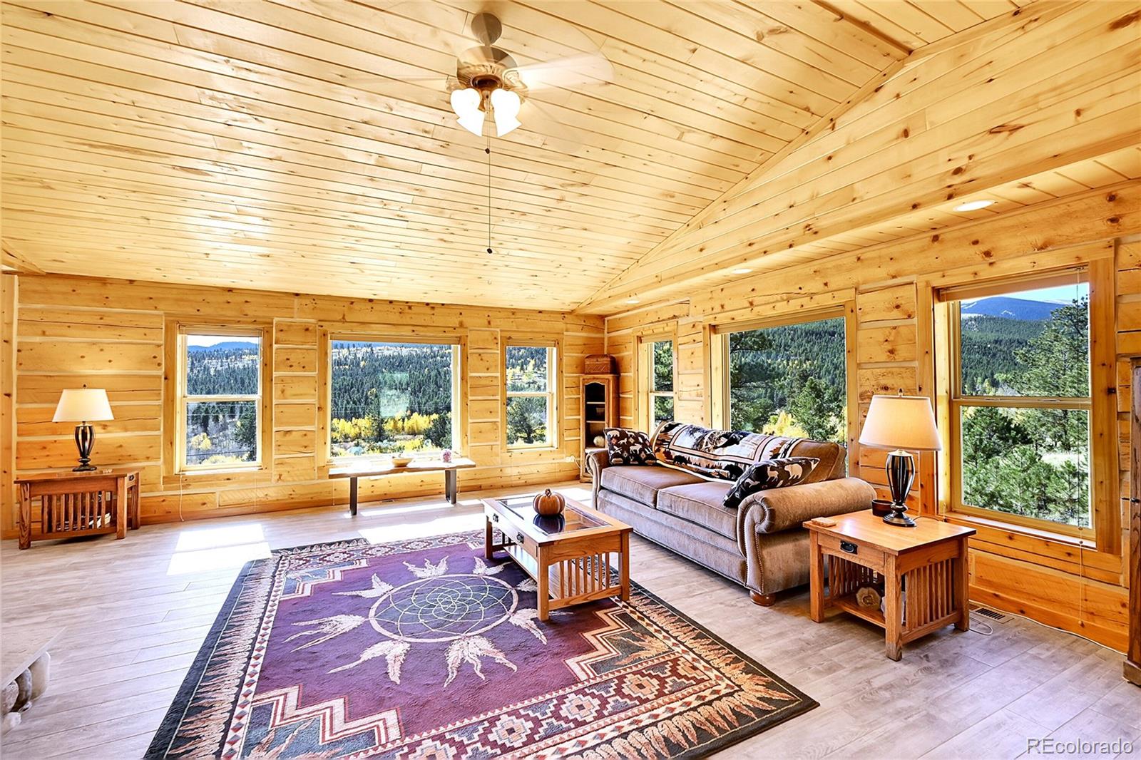 278 Clark Road Bailey, CO 80421 - Photo 10 of 44 a spacious bedroom with furniture and a large window