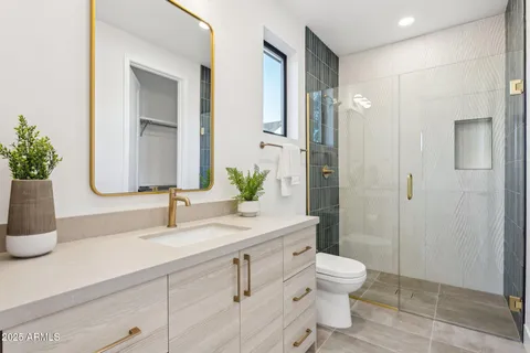 a bathroom with a toilet sink and shower