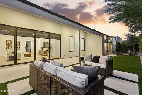 a balcony with furniture and garden