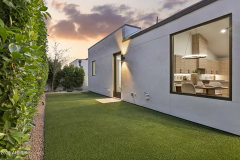 a backyard of a house with lots of green space