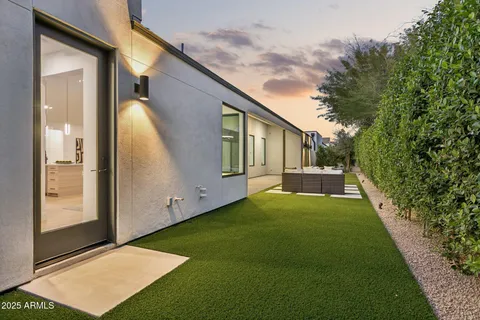 a view of backyard with swimming pool and porch