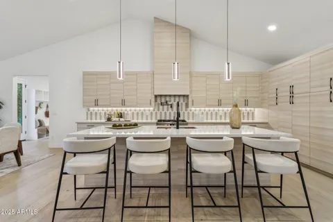 a house that has a sitting space in front of it