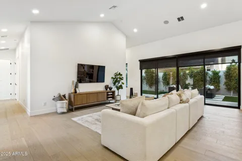 a kitchen with stainless steel appliances a refrigerator and a stove top oven