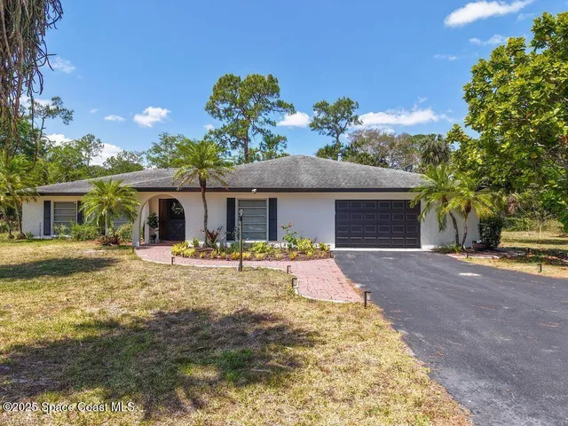 a front view of a house with patio