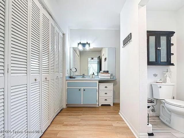 a bathroom with a sink a vanity and a mirror