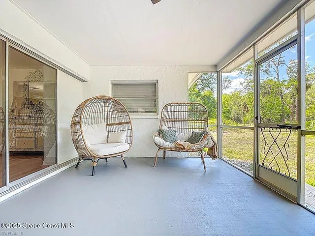 a view of workspace with wooden floor and windows