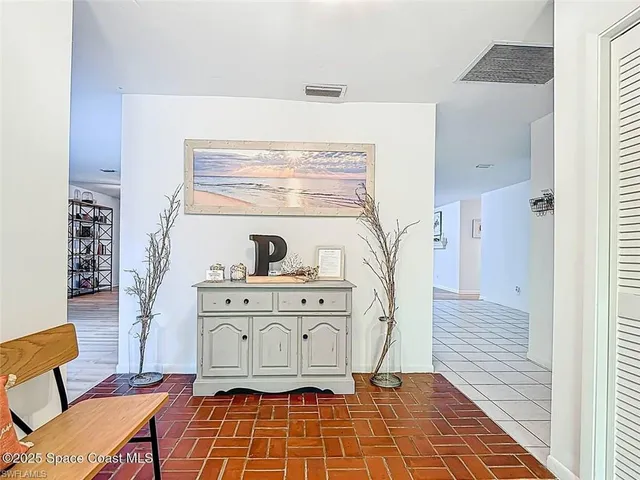 a view of a hallway with chairs