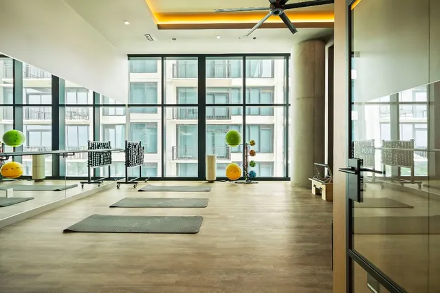 a balcony with furniture and a potted plant