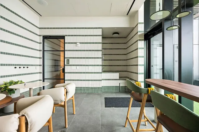 a view of a patio with couches table and chairs and potted plants