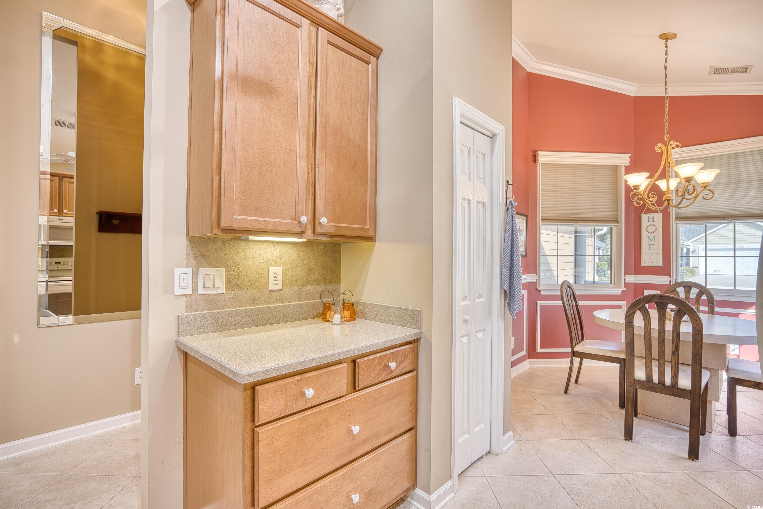 916 Laquinta Loop Murrells Inlet, SC 29576 - Photo 11 of 40 Kitchen featuring a ceiling fan, decorative backsp