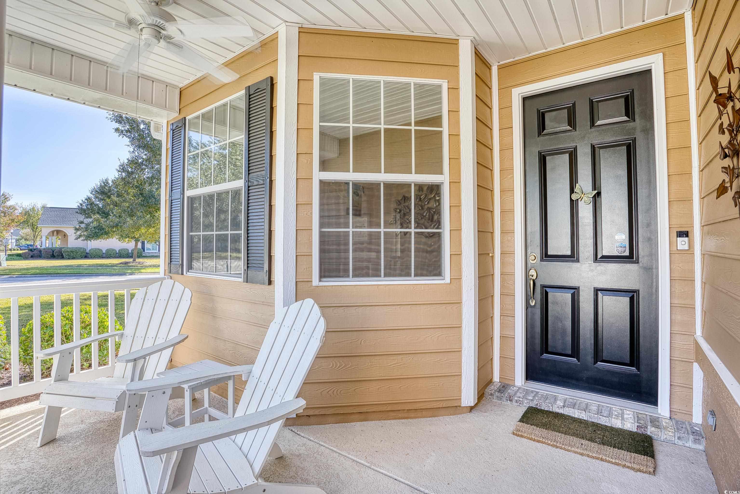 916 Laquinta Loop Murrells Inlet, SC 29576 - Photo 5 of 40 The covered front porch overlooks the front and si