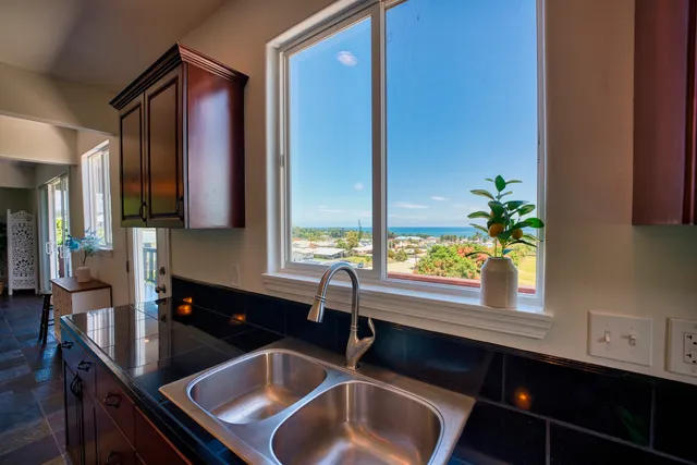 a bathroom with a sink and a large mirror