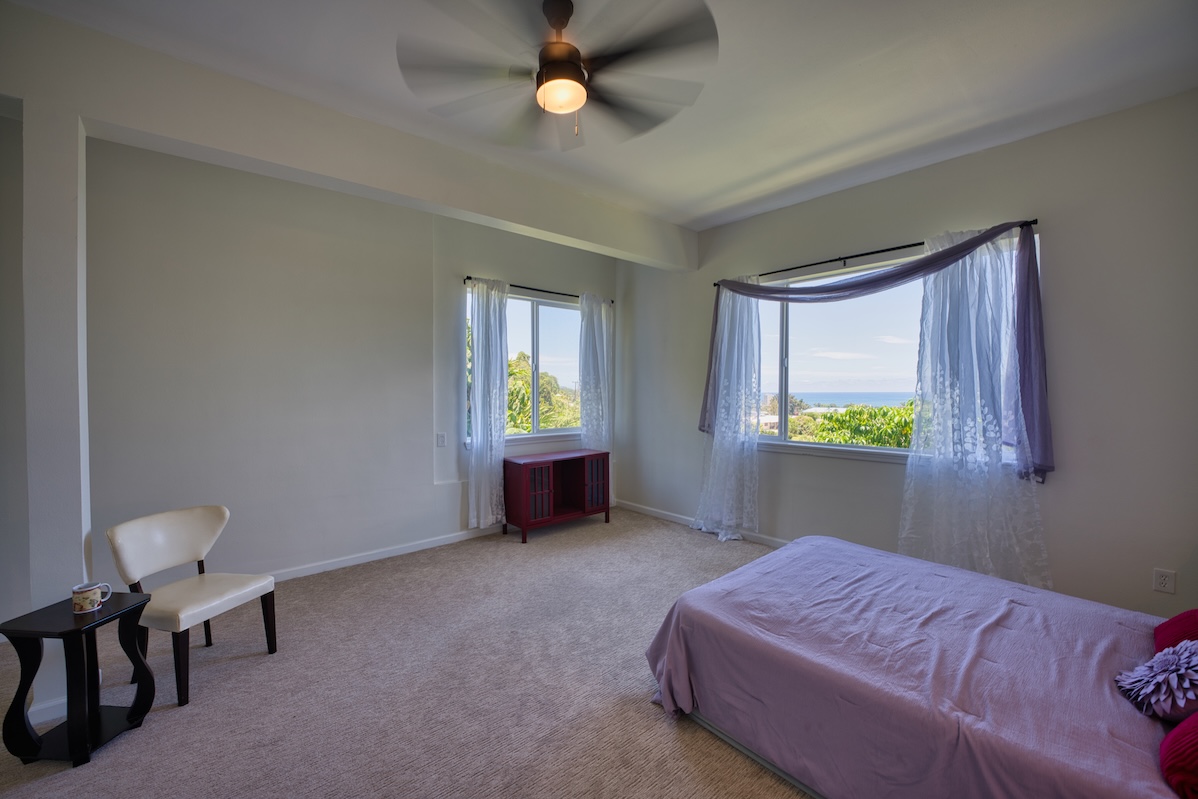 149 Halai Street Hilo, HI 96720 - Photo 21 of 26 a bedroom with a bed and a window