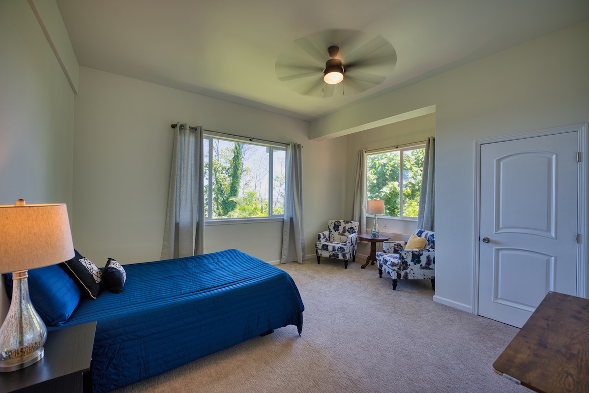 149 Halai Street Hilo, HI 96720 - Photo 23 of 26 a bed room with a bed and a chair