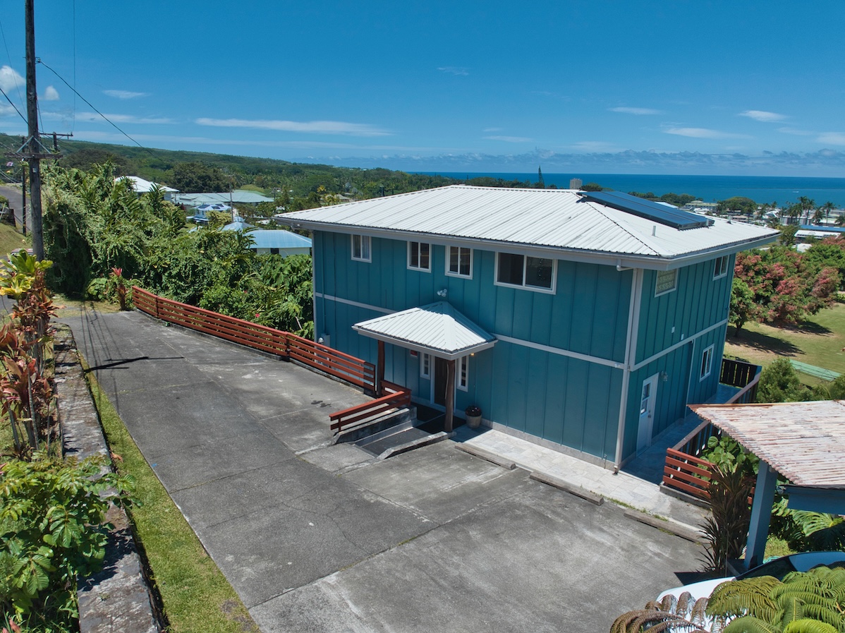 149 Halai Street Hilo, HI 96720 - Photo 26 of 26 a view of a patio with a table and chairs under an umbrella