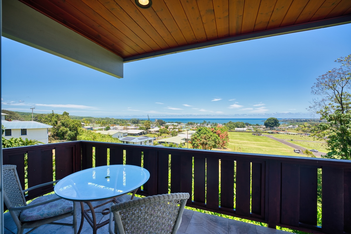 149 Halai Street Hilo, HI 96720 - Photo 4 of 26 a view of a balcony with a table and chairs