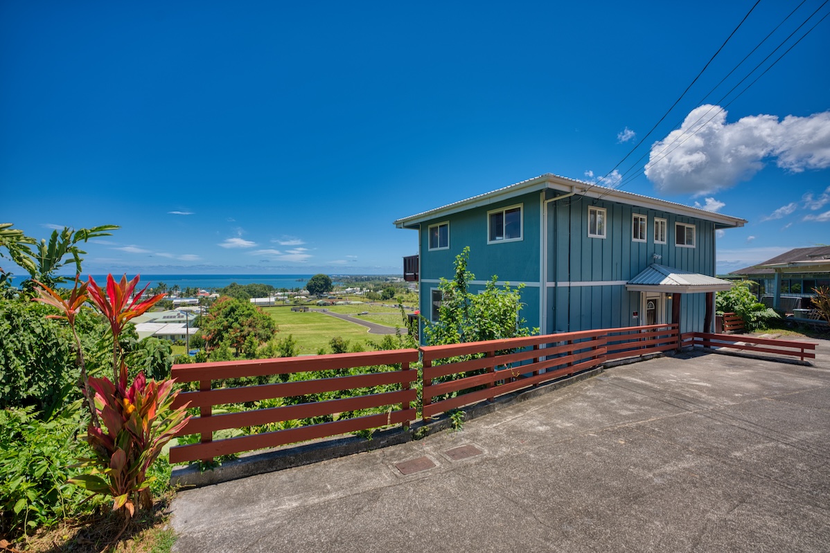 149 Halai Street Hilo, HI 96720 - Photo 5 of 26 a front view of a house with a yard