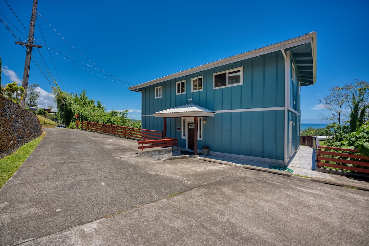 149 Halai Street Hilo, HI 96720 - Photo 6 of 26 a view of a backyard with potted plants and a table and chairs