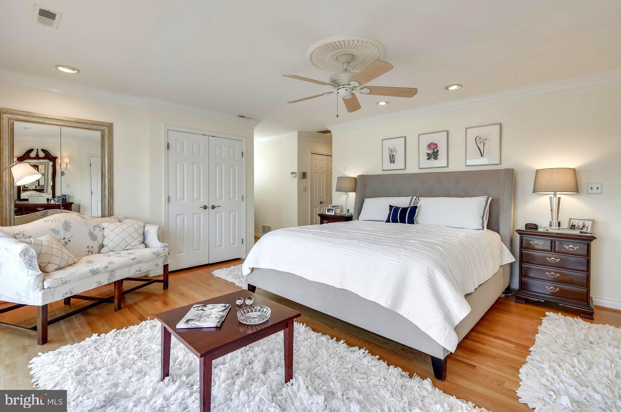 1190 South River Landing Road Edgewater, MD 21037 - Photo 22 of 30 a bedroom with a bed and a chandelier