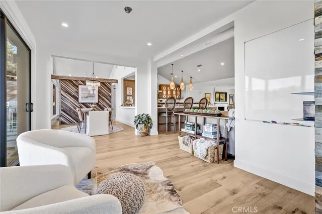 a living room with furniture and a gym machine