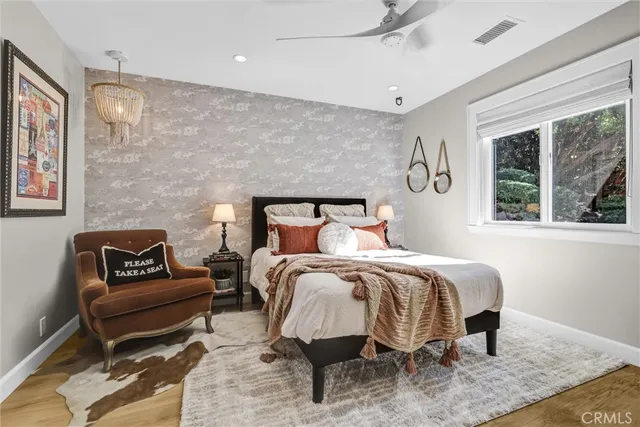 a bedroom with a bed and a couch