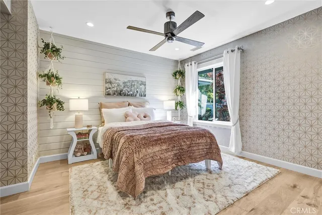 a bed room with a bed and a window