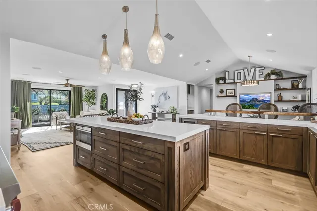 a kitchen with stainless steel appliances granite countertop a stove and a sink