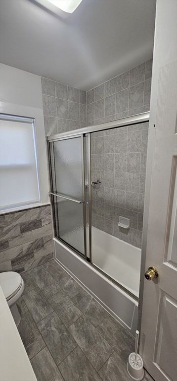 169 Colburn Street, Unit 1 Dedham, MA 02026 - Photo 12 of 12 a bathroom with a shower