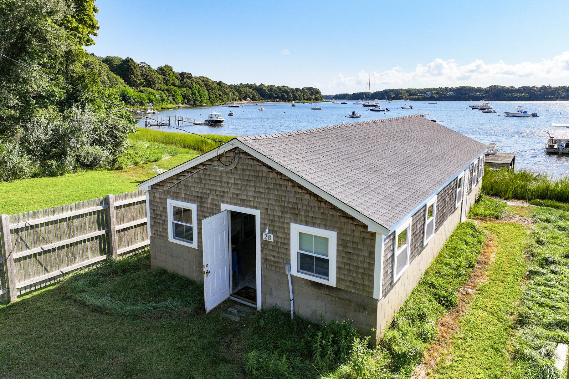 28 Little River Road Cotuit, MA 02635 - Photo 2 of 17 an aerial view of residential house with outdoor space and seating