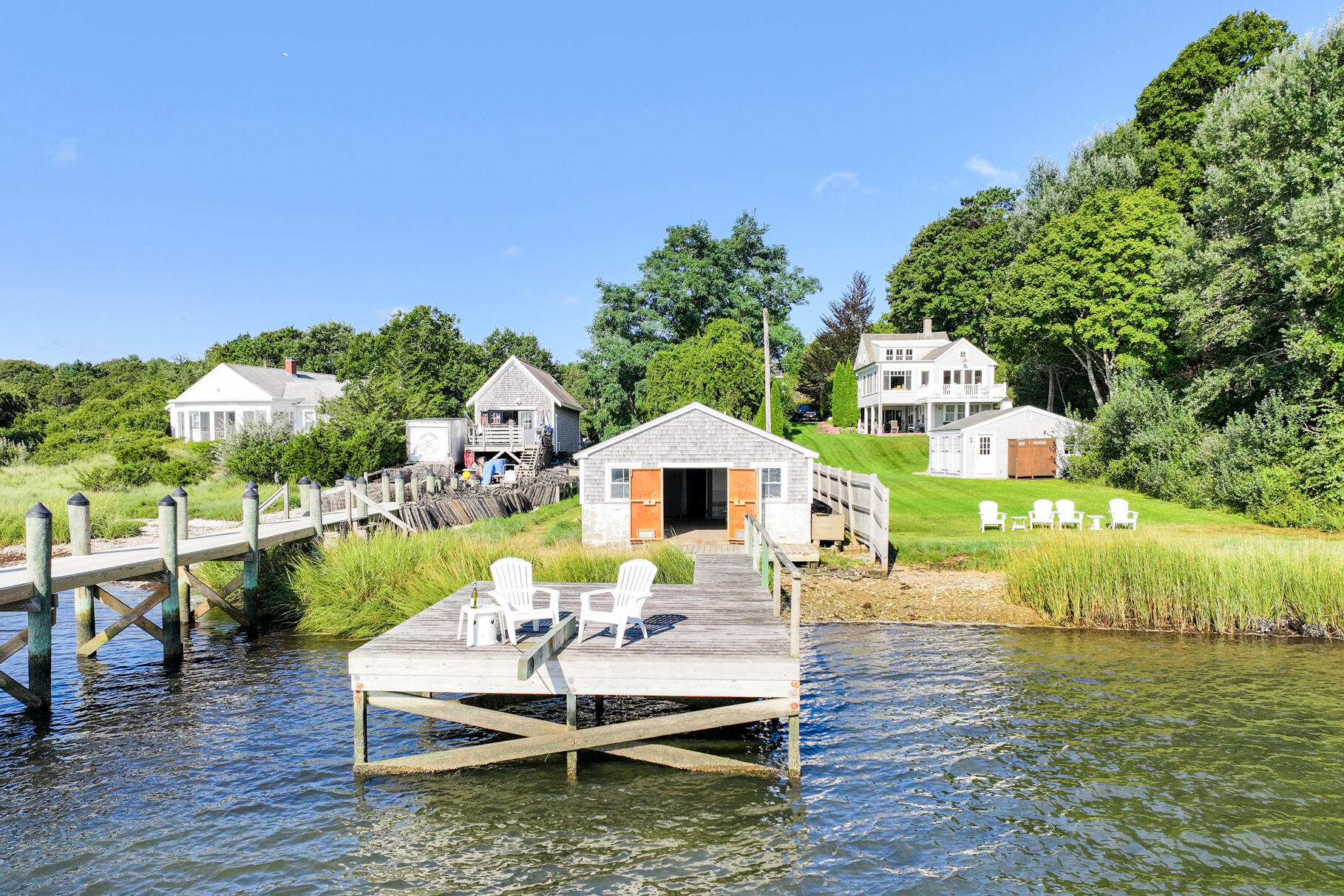 28 Little River Road Cotuit, MA 02635 - Photo 5 of 17 a view of a house with backyard porch and furniture