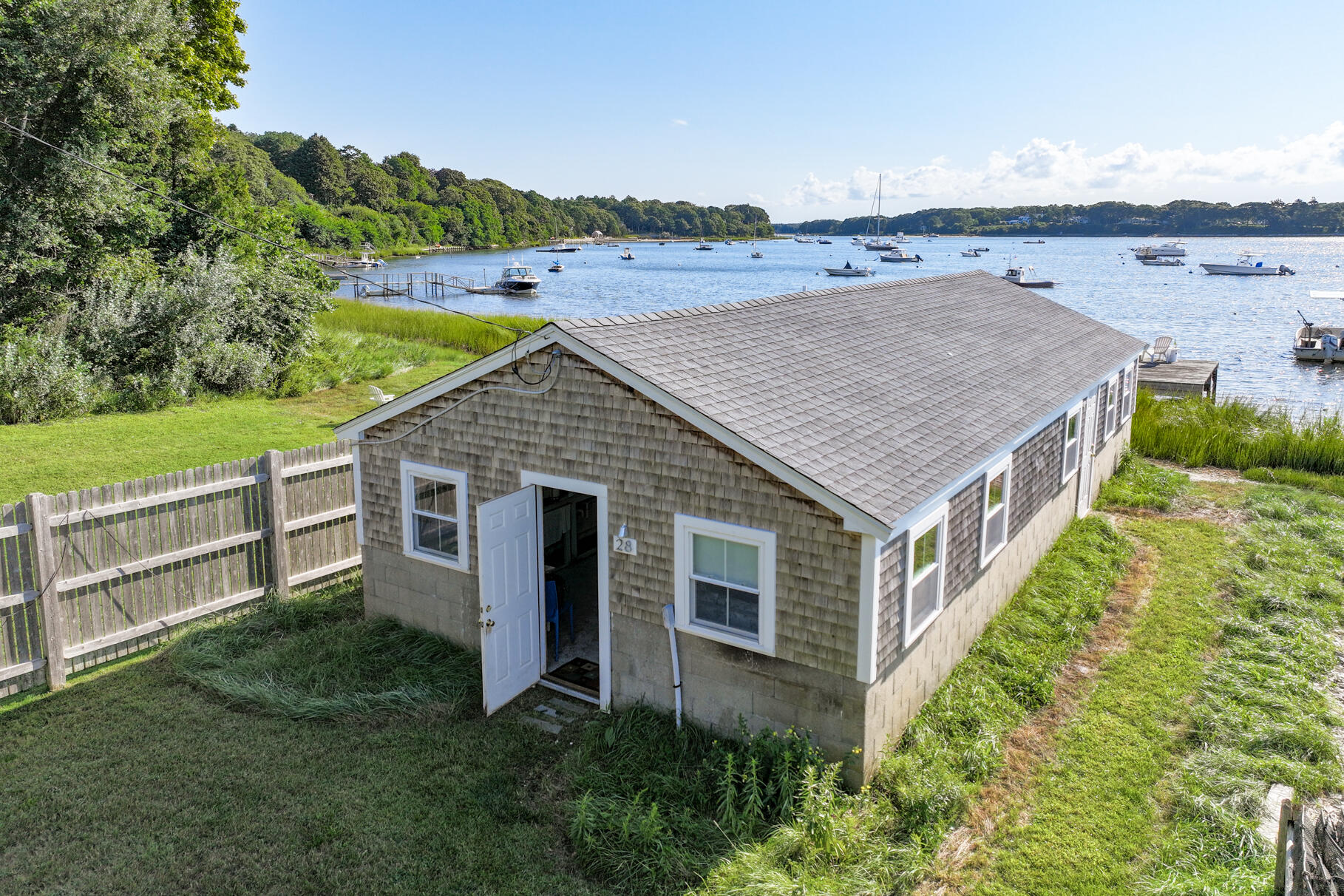 28 Little River Road Cotuit, MA 02635 - Photo 7 of 17 an aerial view of residential house with outdoor space and seating