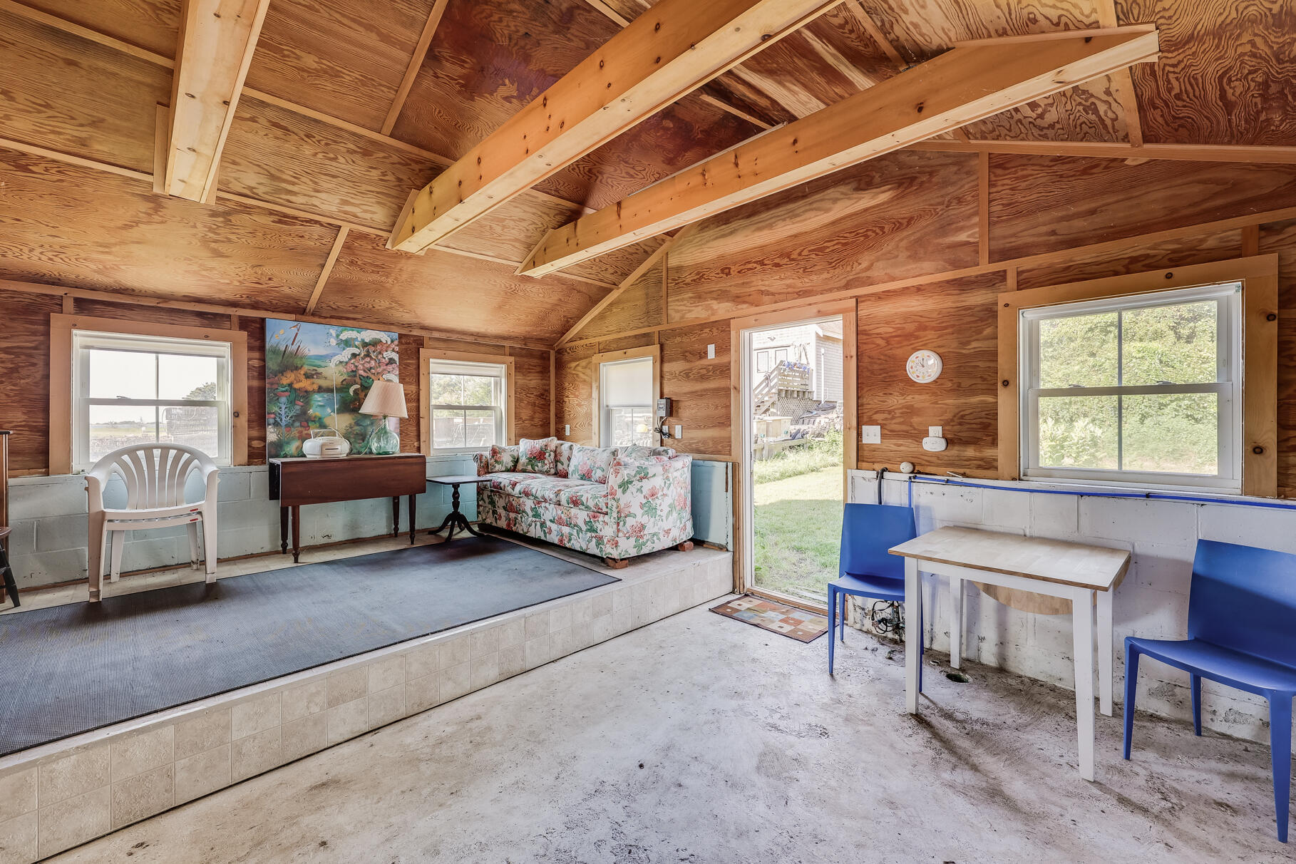 28 Little River Road Cotuit, MA 02635 - Photo 10 of 17 a living room with furniture and a large window