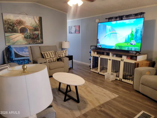 a living room with furniture and a flat screen tv