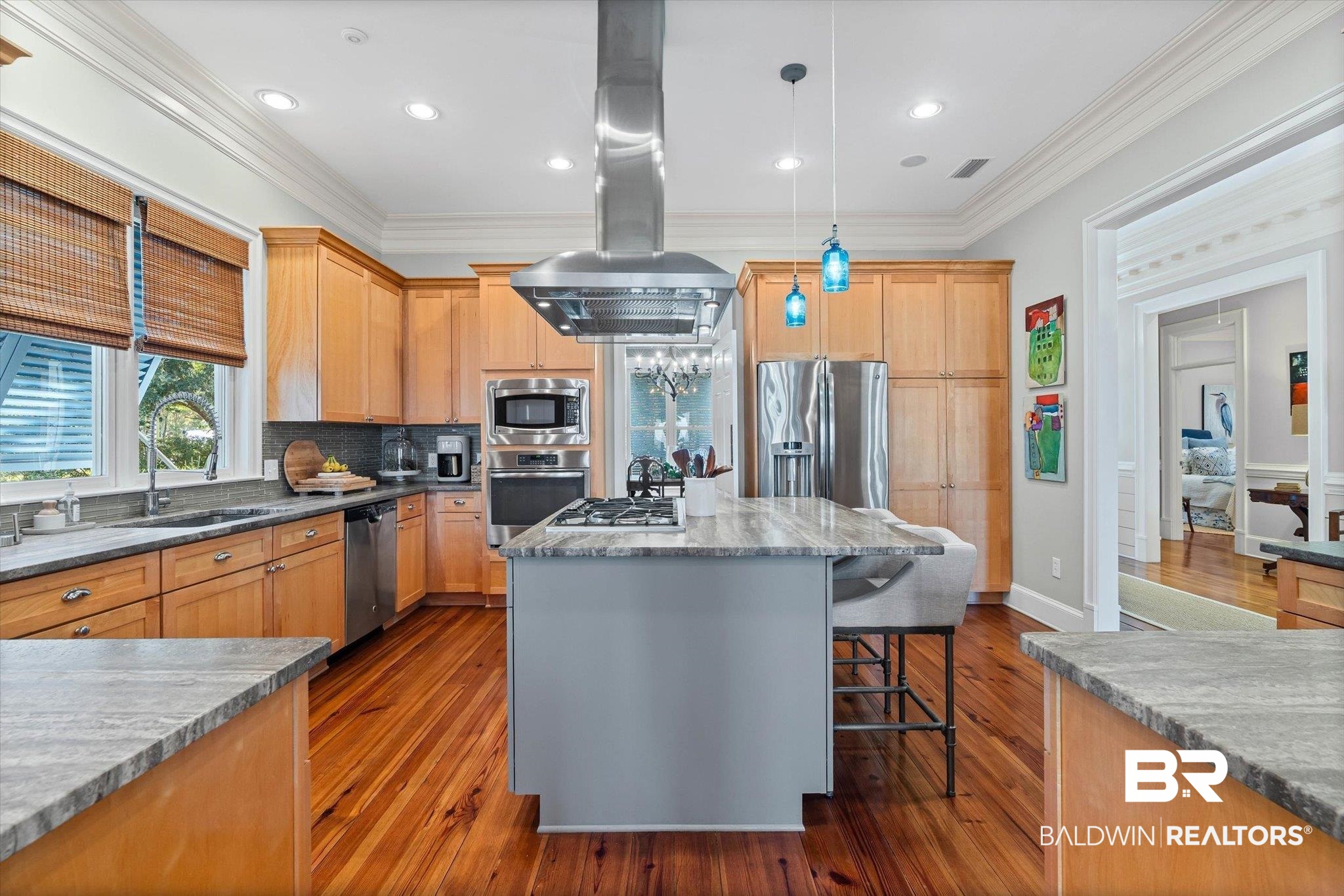 7015 Bay Road Mobile, AL 36605 - Photo 10 of 53 Kitchen with recessed lighting, island exhaust hood, a breakfast bar area, stainless steel appliances, and dark wood finished floors