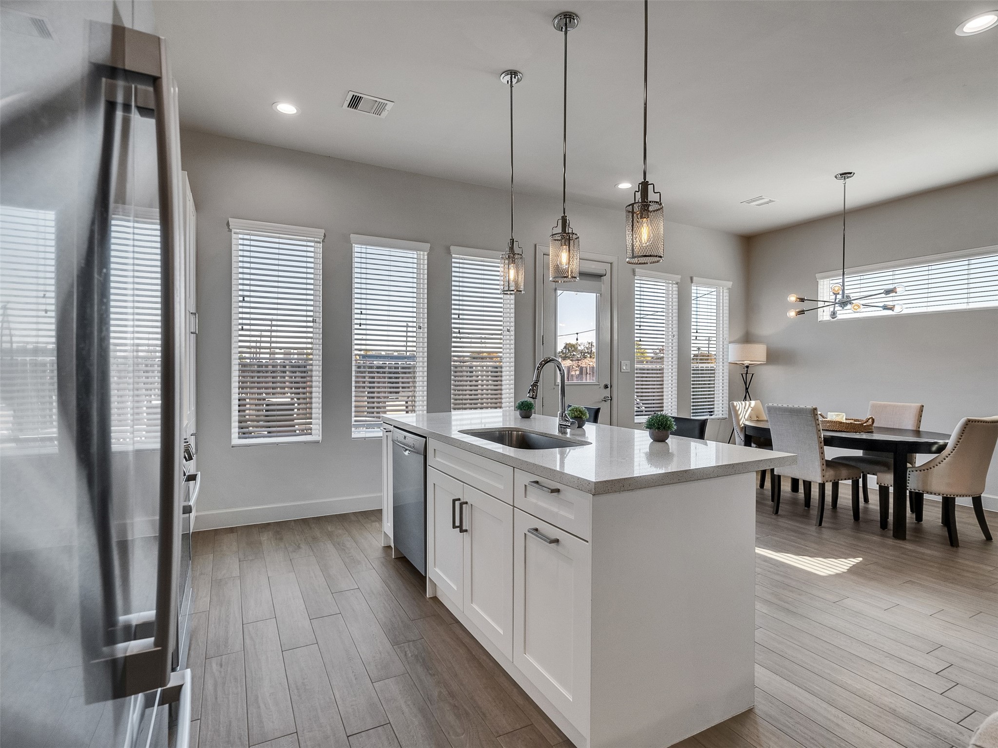 5702 Rucio Lane Houston, TX 77092 - Photo 12 of 30 a large kitchen with kitchen island a large island in it