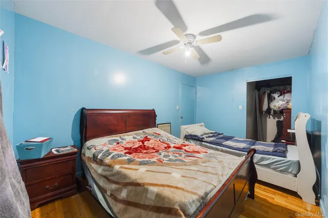 a bed room with a bed and a chandelier