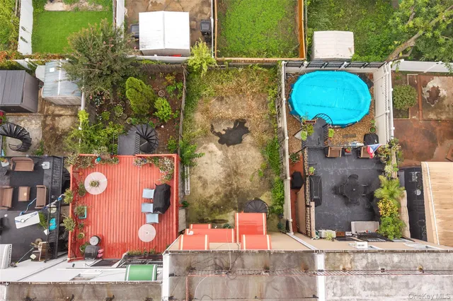 an aerial view of residential house with outdoor space and parking