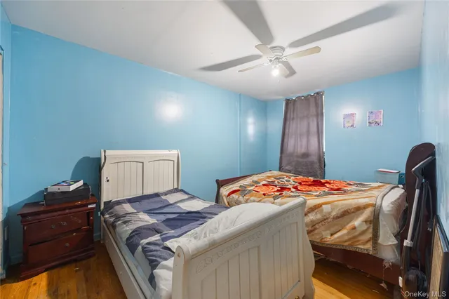 a bedroom with a bed and a dresser in it