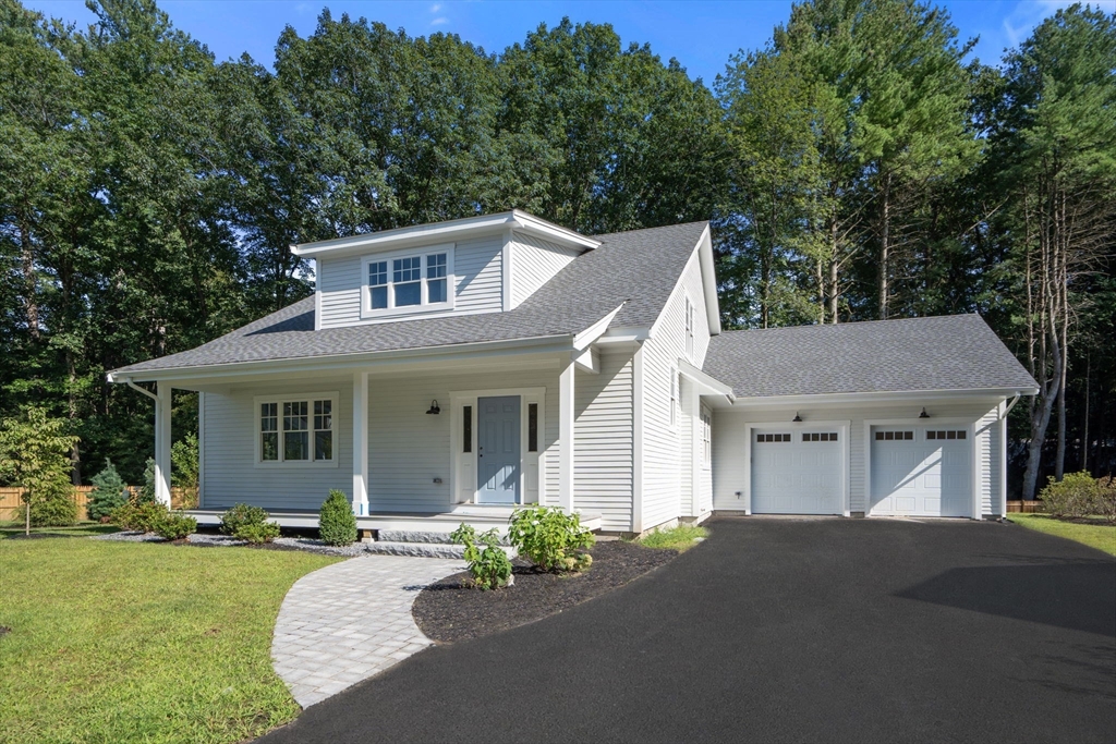 3 Emmeline Path, Unit 3 Wayland, MA 01778 - Photo 1 of 22 a front view of a house with a garden and yard